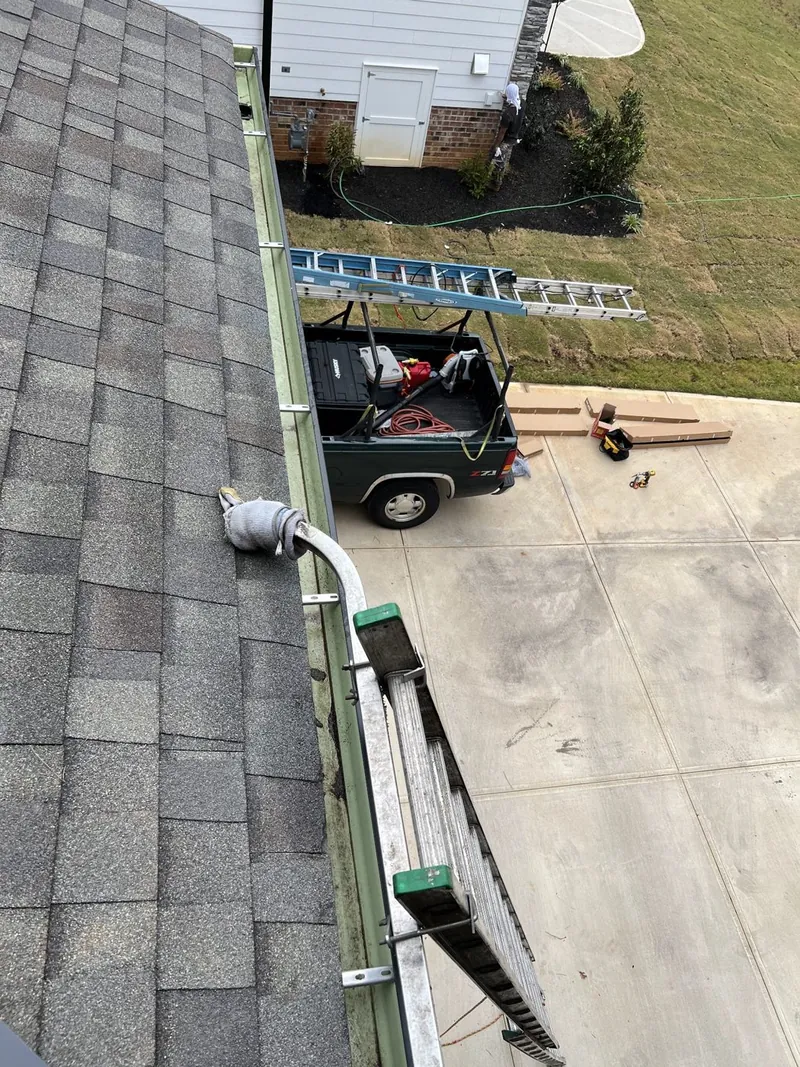 Roofline, gutter, and service vehicle below