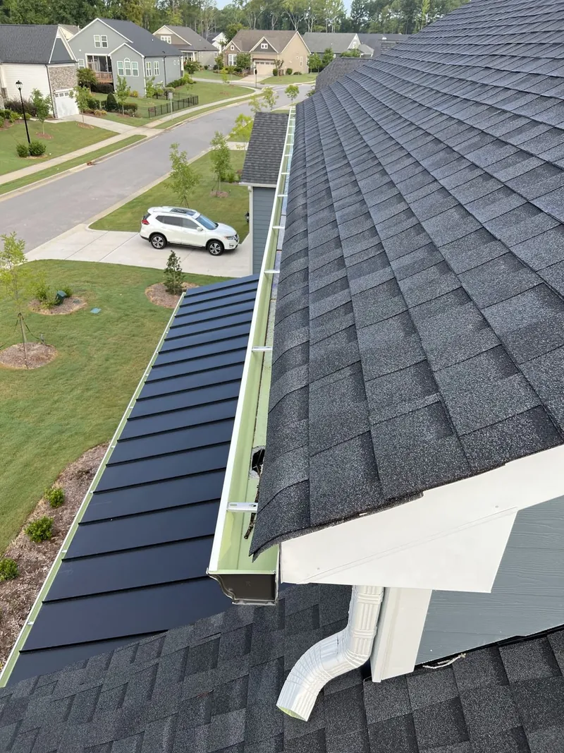 Clean gutter running along a residential roof