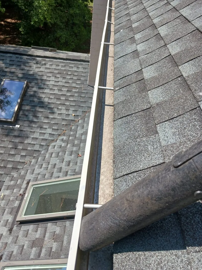 Residential roof valley and gutter seen from above